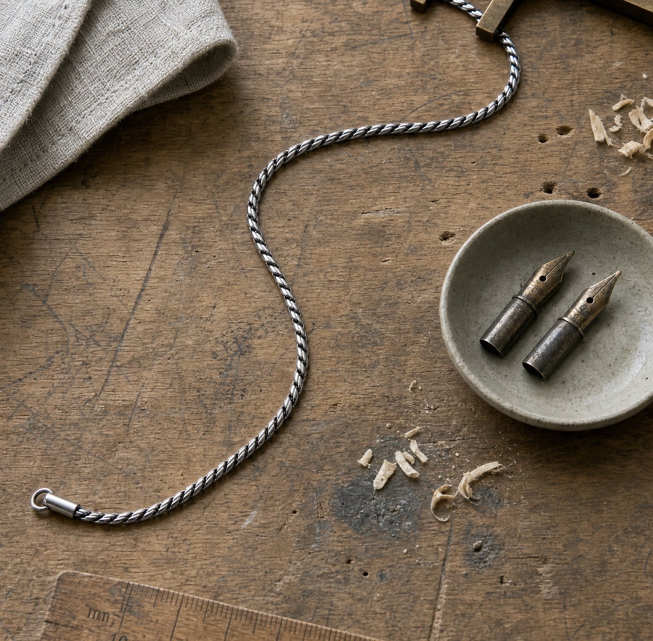 Serpent chain on a workbench, still life